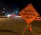 Street with "sobriety checkpoint ahead" sign