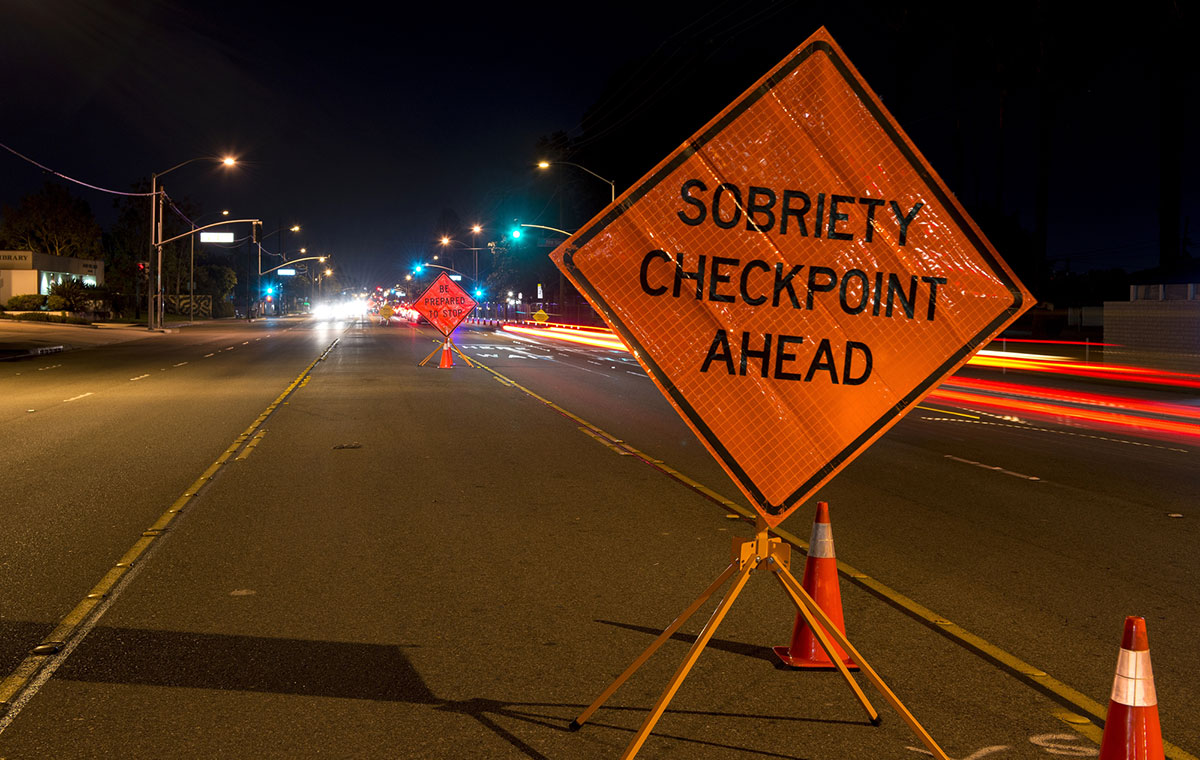 Sobriety checkpoint ahead sign on street